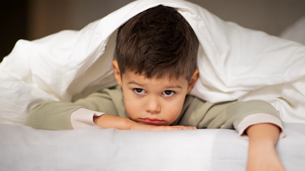 Peaceful sleeping child in bed