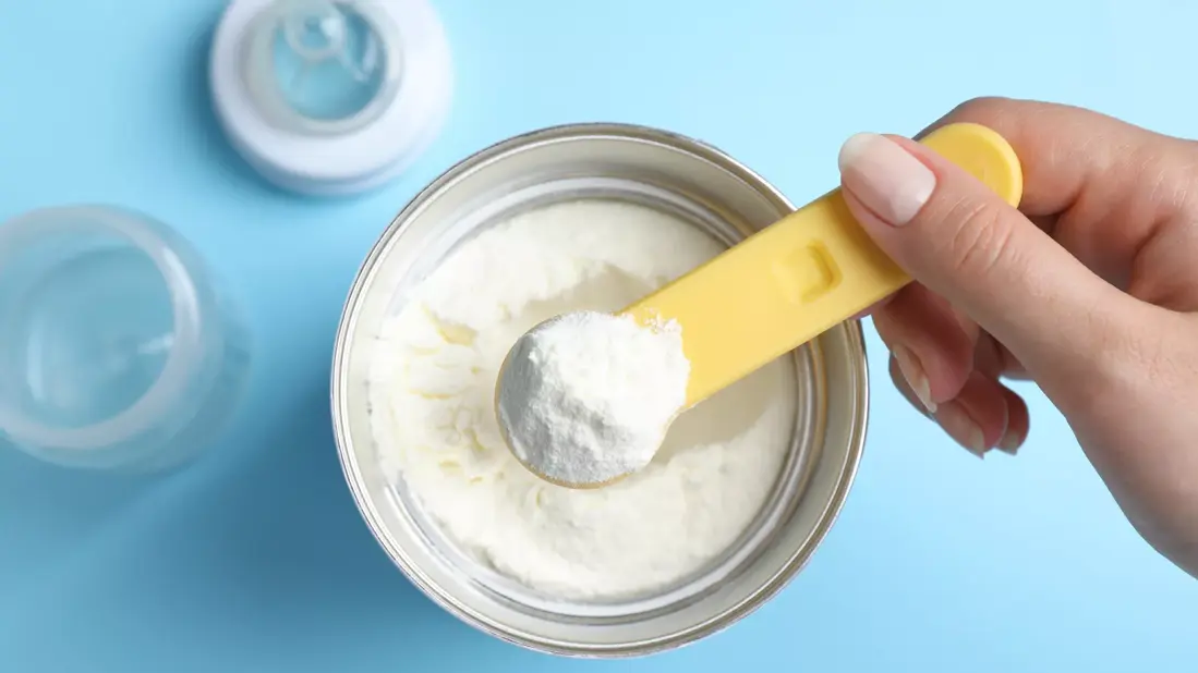 Baby formula powder container showing Canadian parents how to save with coupons