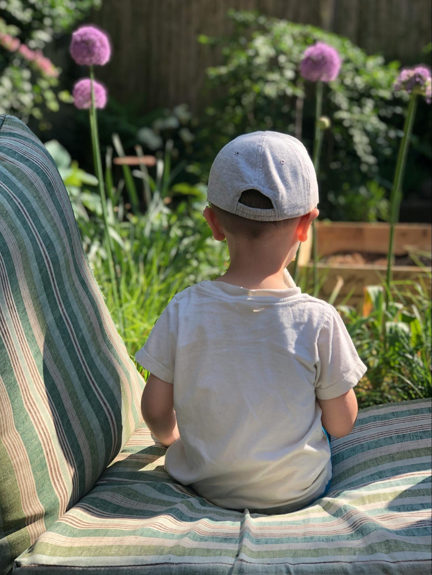 Baby wearing sun hat and protective clothing for Canadian sun safety