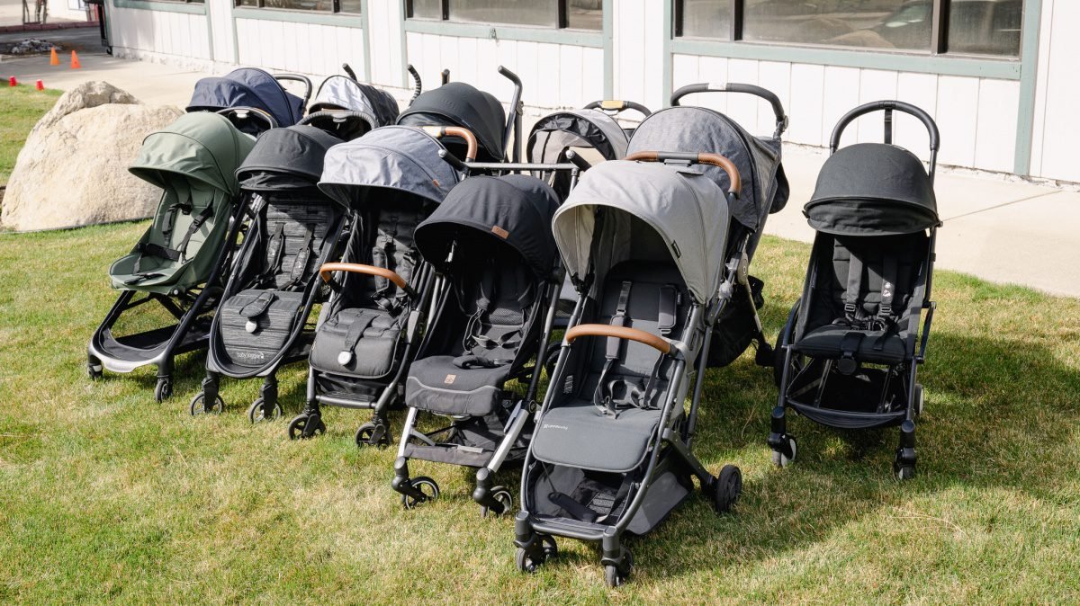 Parent using lightweight travel stroller for easy transportation with child