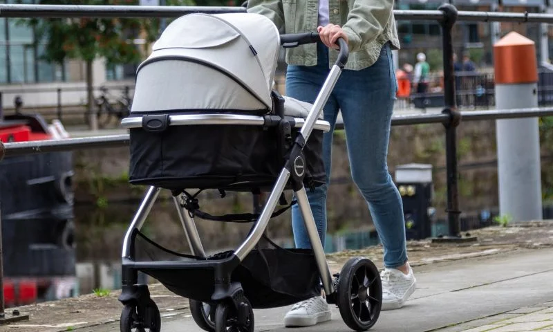 Travel stroller system showcasing compact folding and portability features