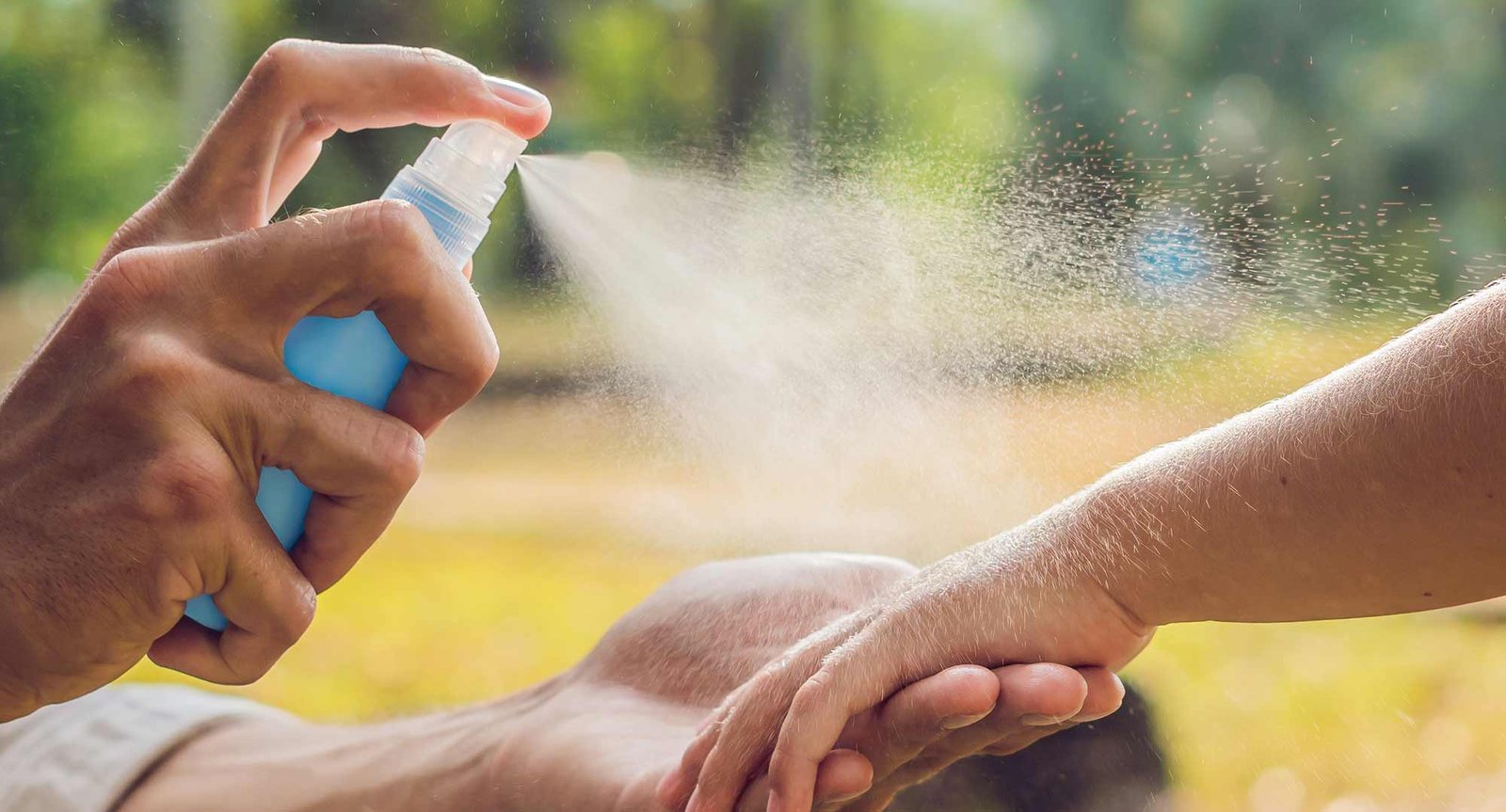Canadian mother carefully applying safe mosquito repellent to protect newborn baby