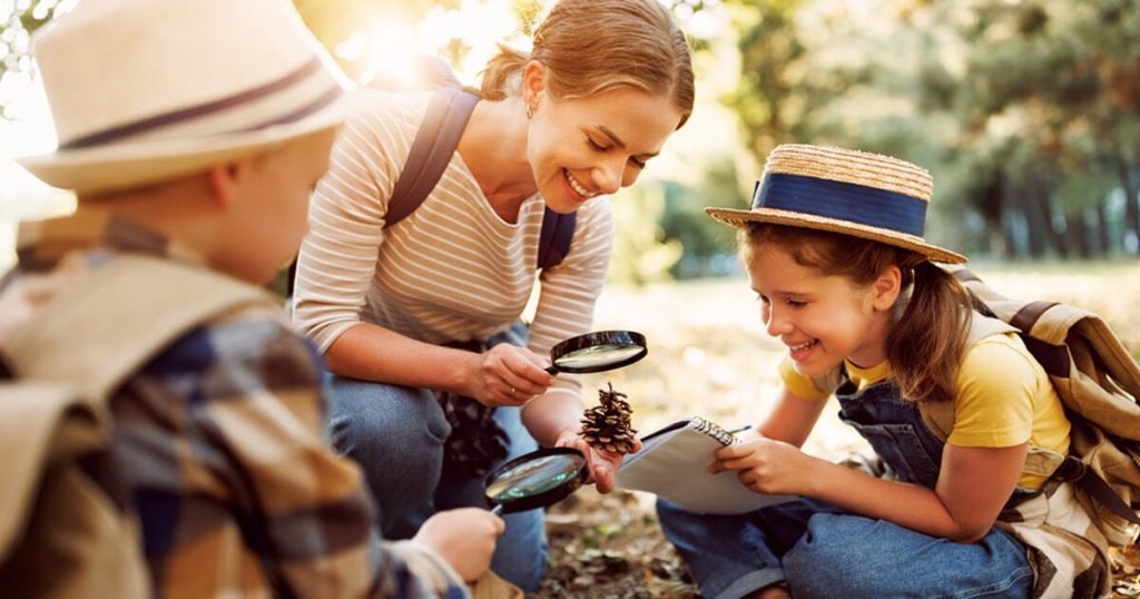 Canadian family engaged in summer learning activities with educational resources and nature exploration