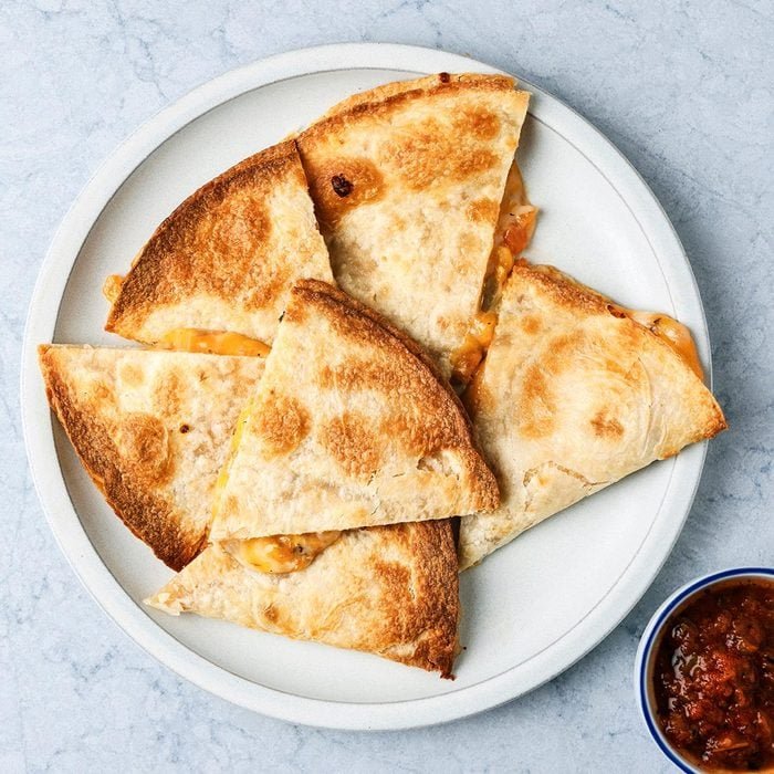Delicious air fryer quesadilla cut into triangles for kids lunch