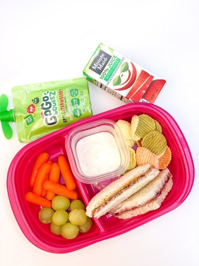 Creative school lunch for picky eaters with colorful, fun-shaped foods in lunchbox
