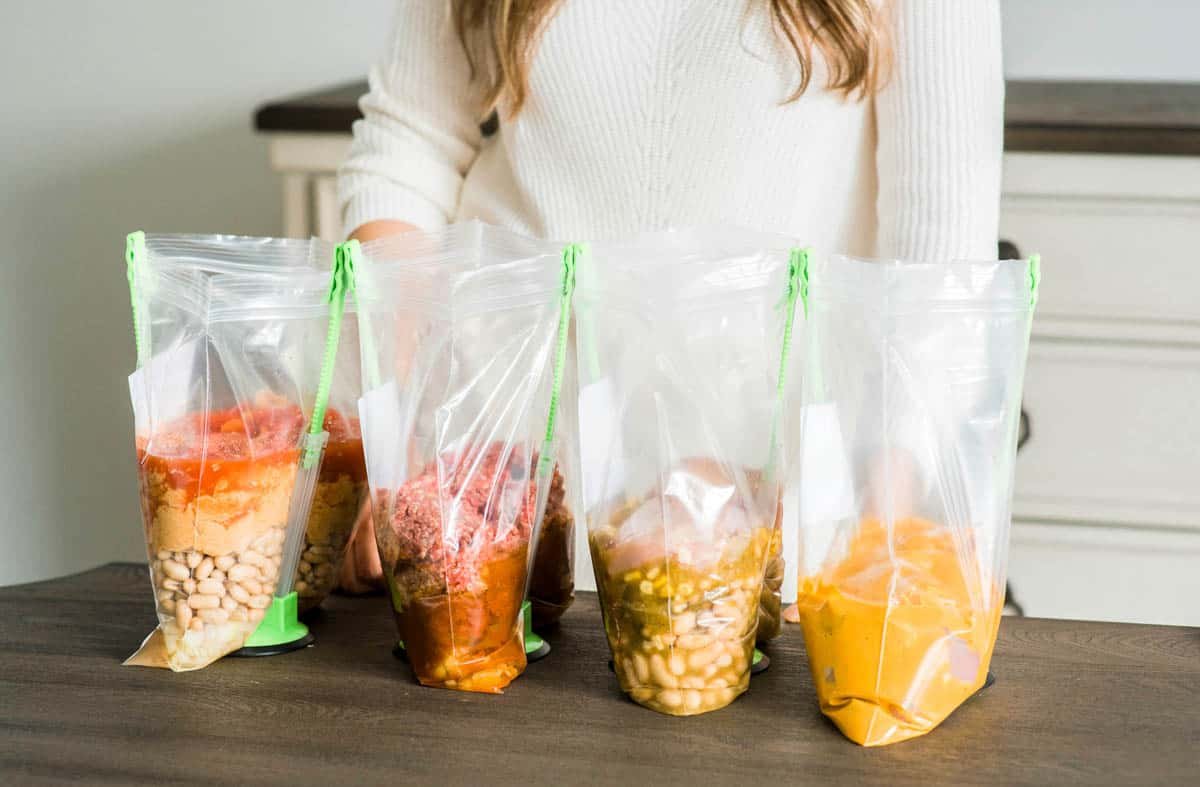 Healthy freezer meal prep containers organized for new moms postpartum nutrition