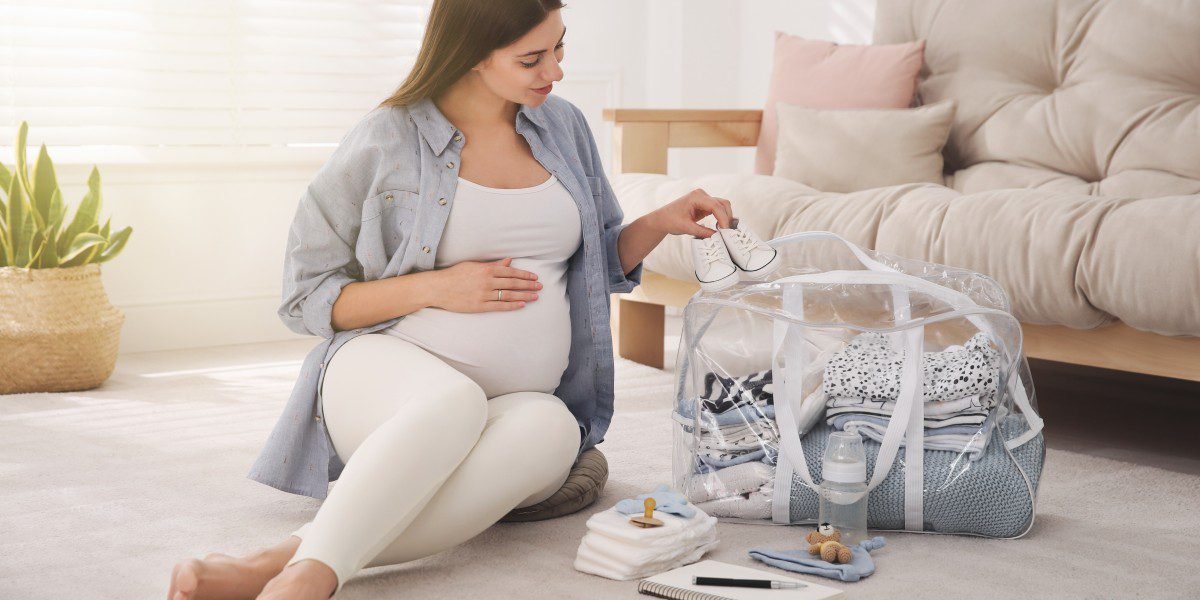 Canadian pregnant woman preparing maternity leave budget and packing hospital bag for fall delivery