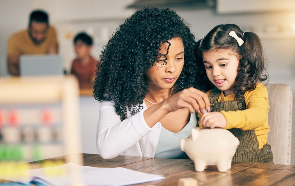 Canadian family learning about savings with piggy bank and money