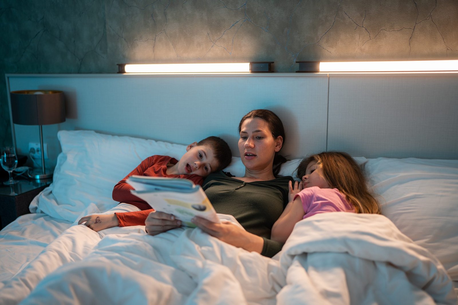 Canadian mother and children enjoying bedtime routine with reading and family bonding time