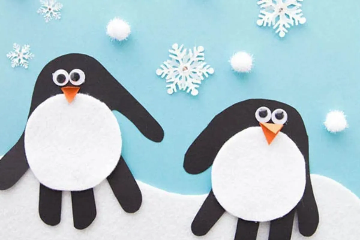 Cute handprint penguin craft for holiday memories