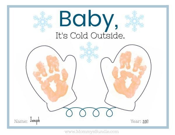 Children showing off mitten print crafts for the holidays