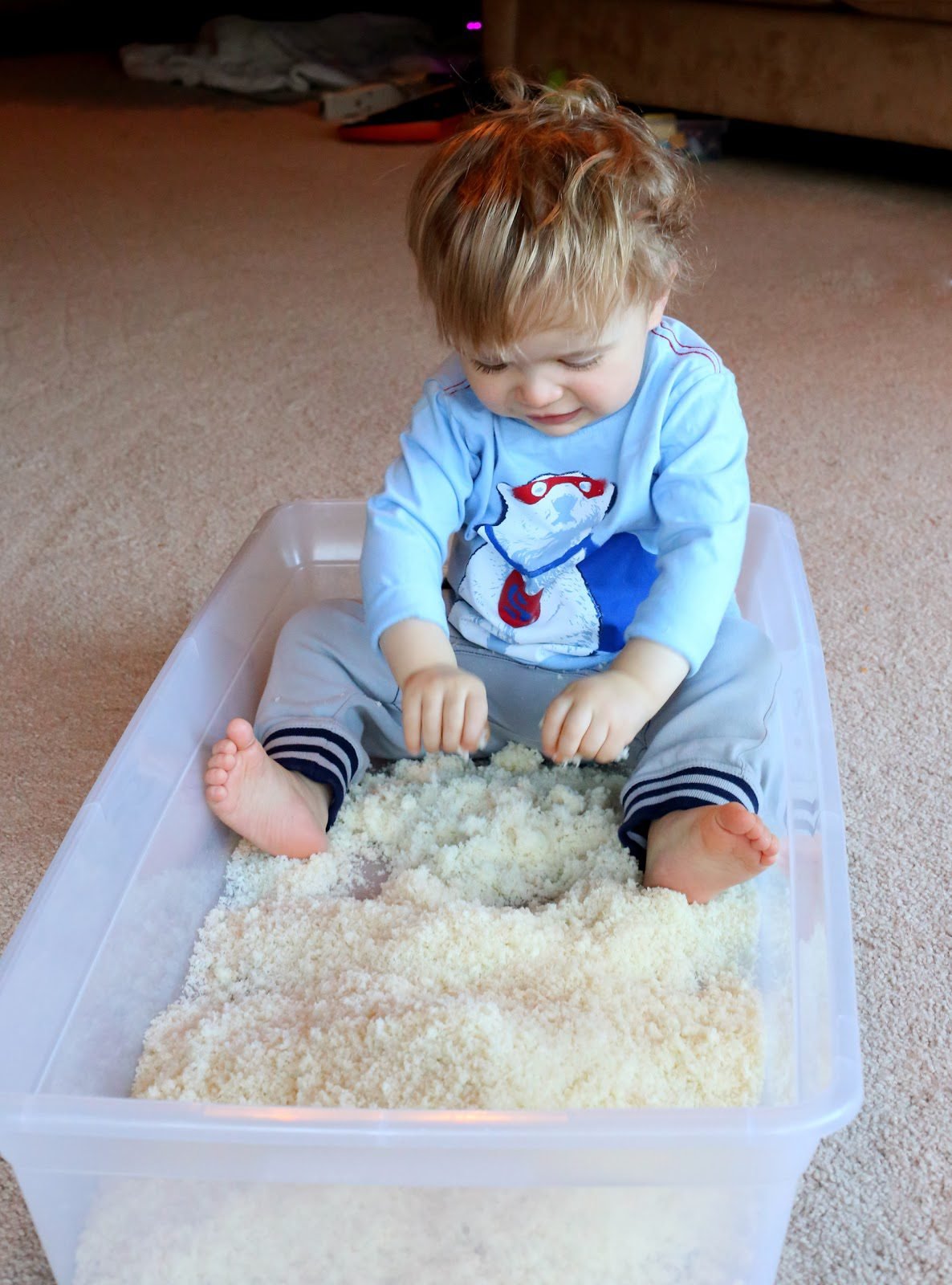 Parent and toddler playing cozy indoor winter activities in Canada