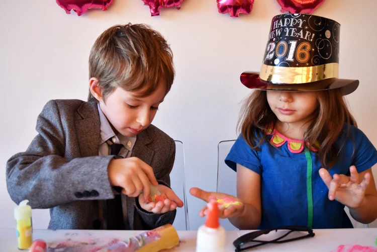 Young children celebrating Happy New Year with family